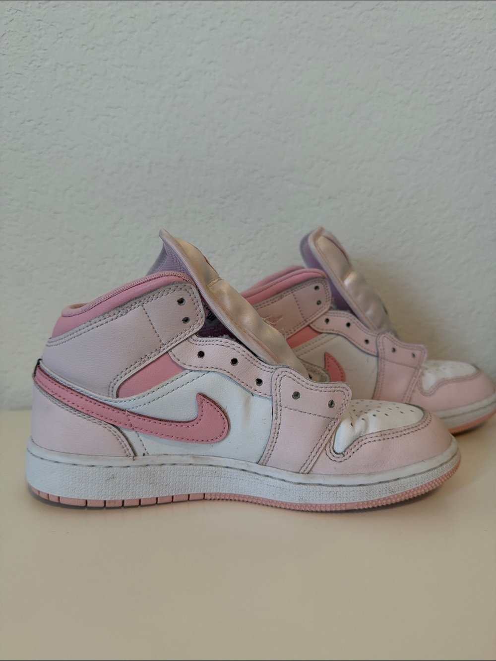 Nike Air Jordan Kids Pink and White High-Top Sneakers with Pink Swoosh